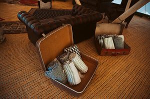 5 blankets in a vintage suitcase